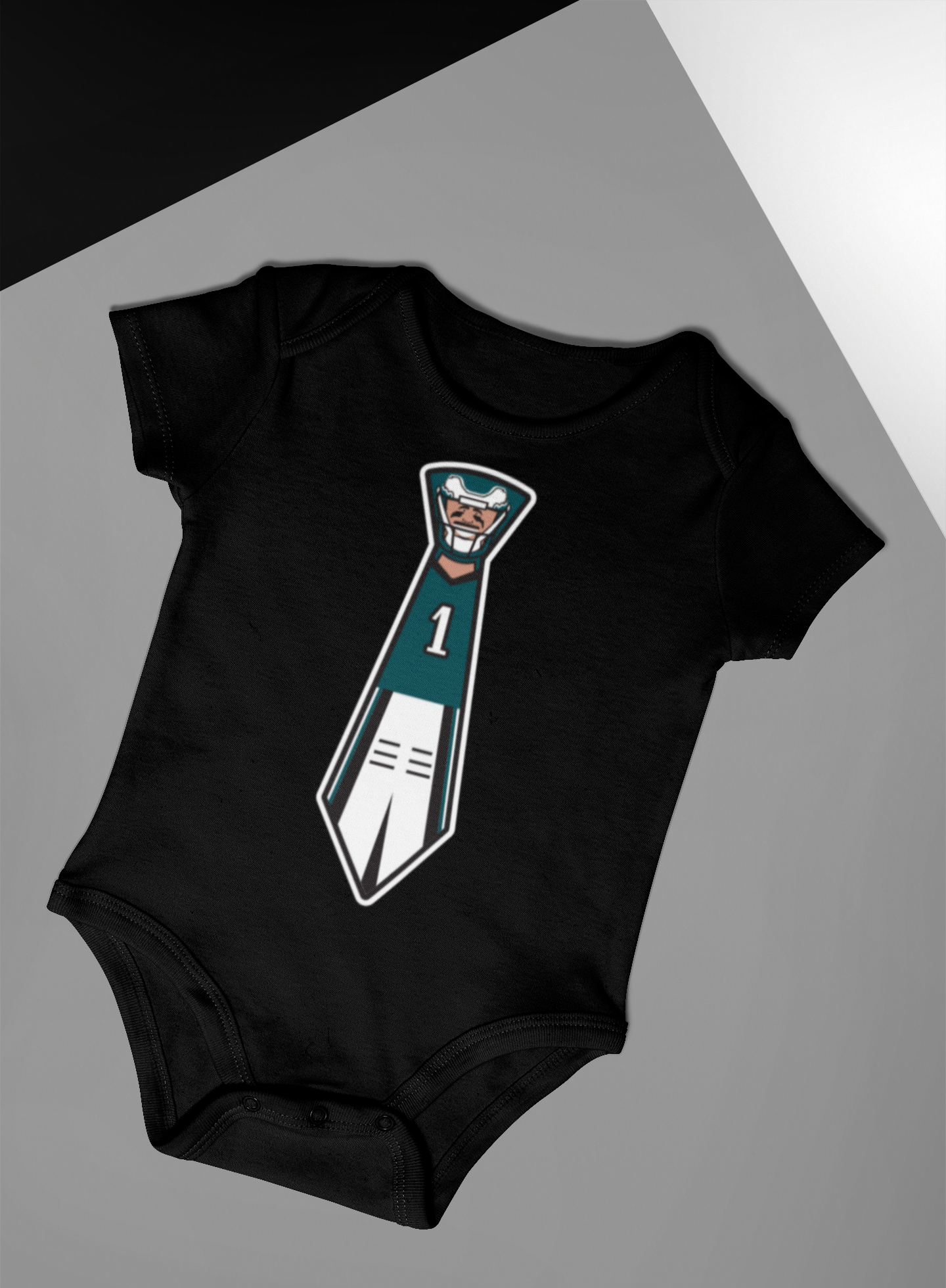 Eagles black onsie with Jalen Hurts tie